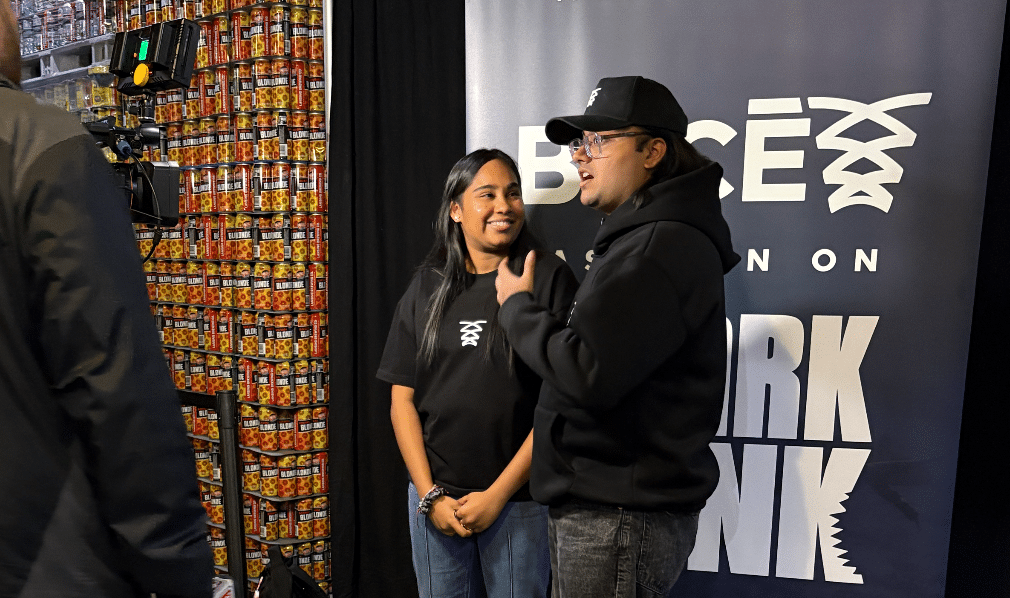 DemoDay Lansing event picture showing participants in a group photo at the front of the room.